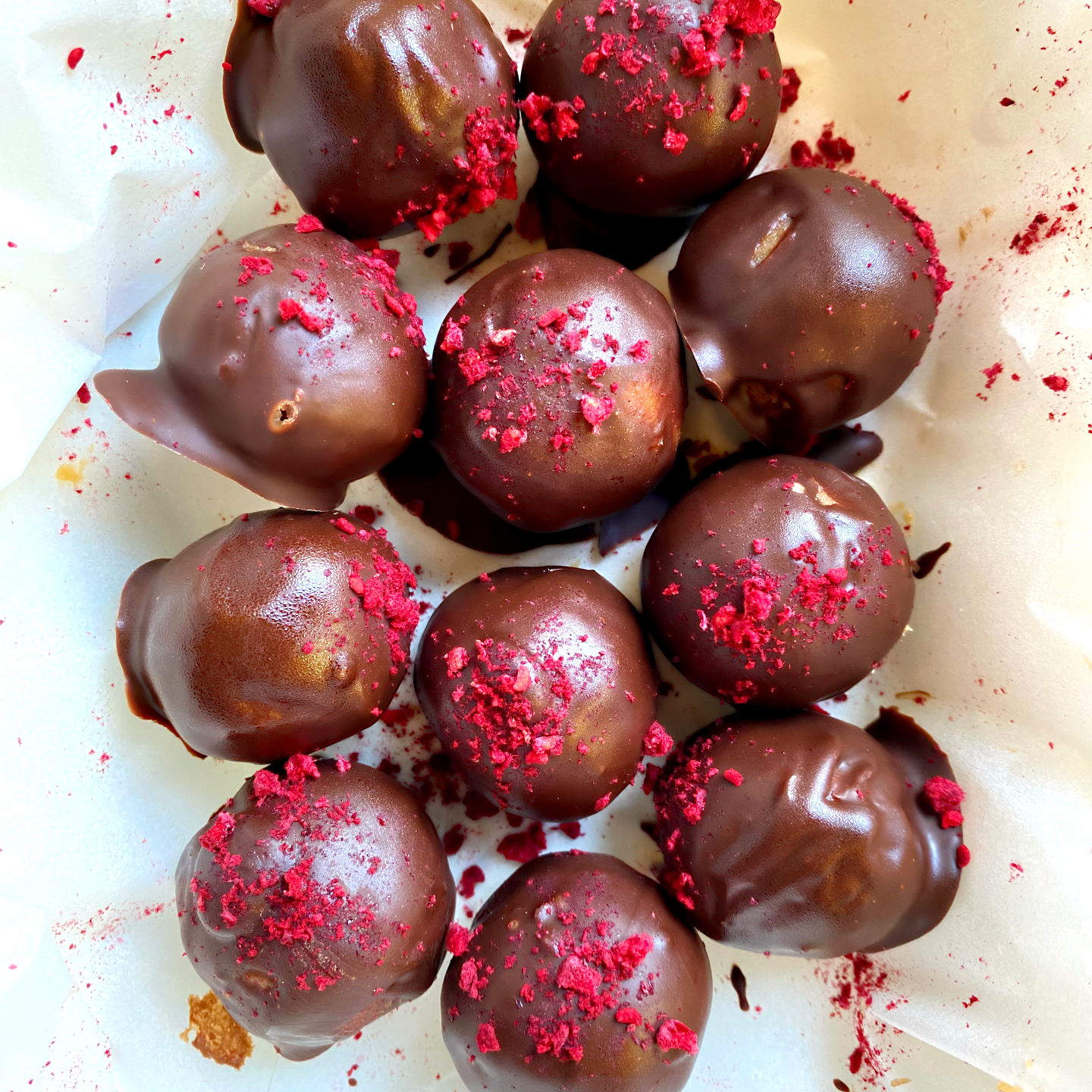 Chocolate Covered Truffles with White Chocolate Raspberry Ganache